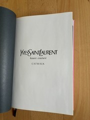 YVES SAINT LAURENT, HAUTE COUTURE CATWALK. THAMES & HUDSON. HARDCOVER. 652 PAGES