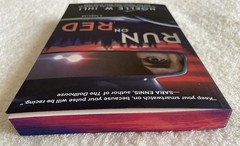 Run on Red by Noelle W. Ihli. Paperback. (Stenciled Edges)