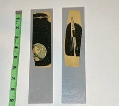 2 handmade space age book cutout bookmarks, roughly 2.5 in x 9 in